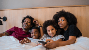 Snuggling under blankets watching movies is a great autism-friendly activity.