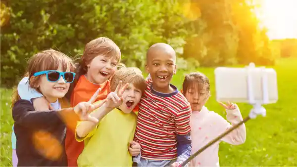 kids during sunset playing outside How to Help Your Child Make Friends