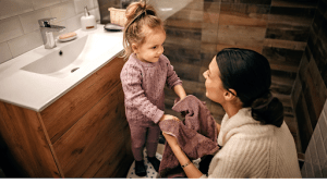 unnamed (4) - The Autism Therapy Group - ABA Therapy Mom and daughter in bathroom