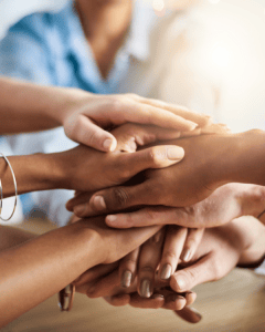 Hands joined together, showing the ATG commitment to care