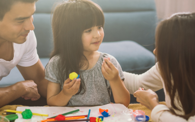 Child in autism therapy with parents