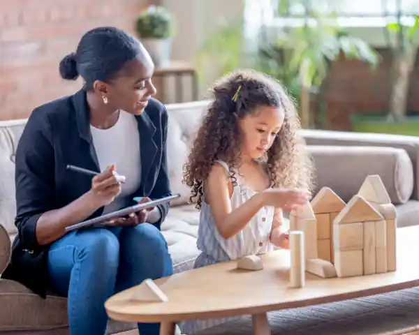 aba therapist observing child