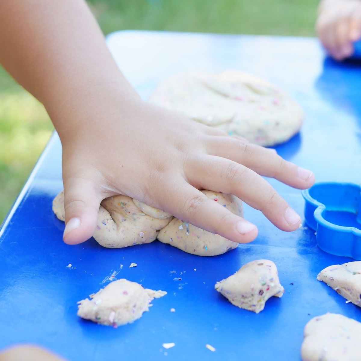 Child practicing a sensory play activity with modeling dough for adaptive ABA therapy in Addison, IL