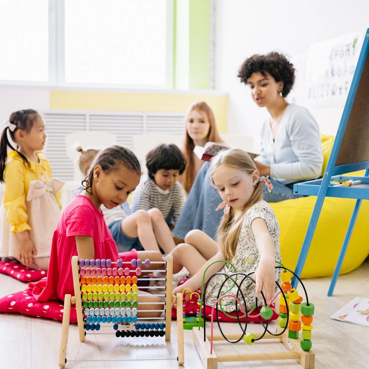 Young children practicing hands-on learning activities for early intervention ABA in Illinois