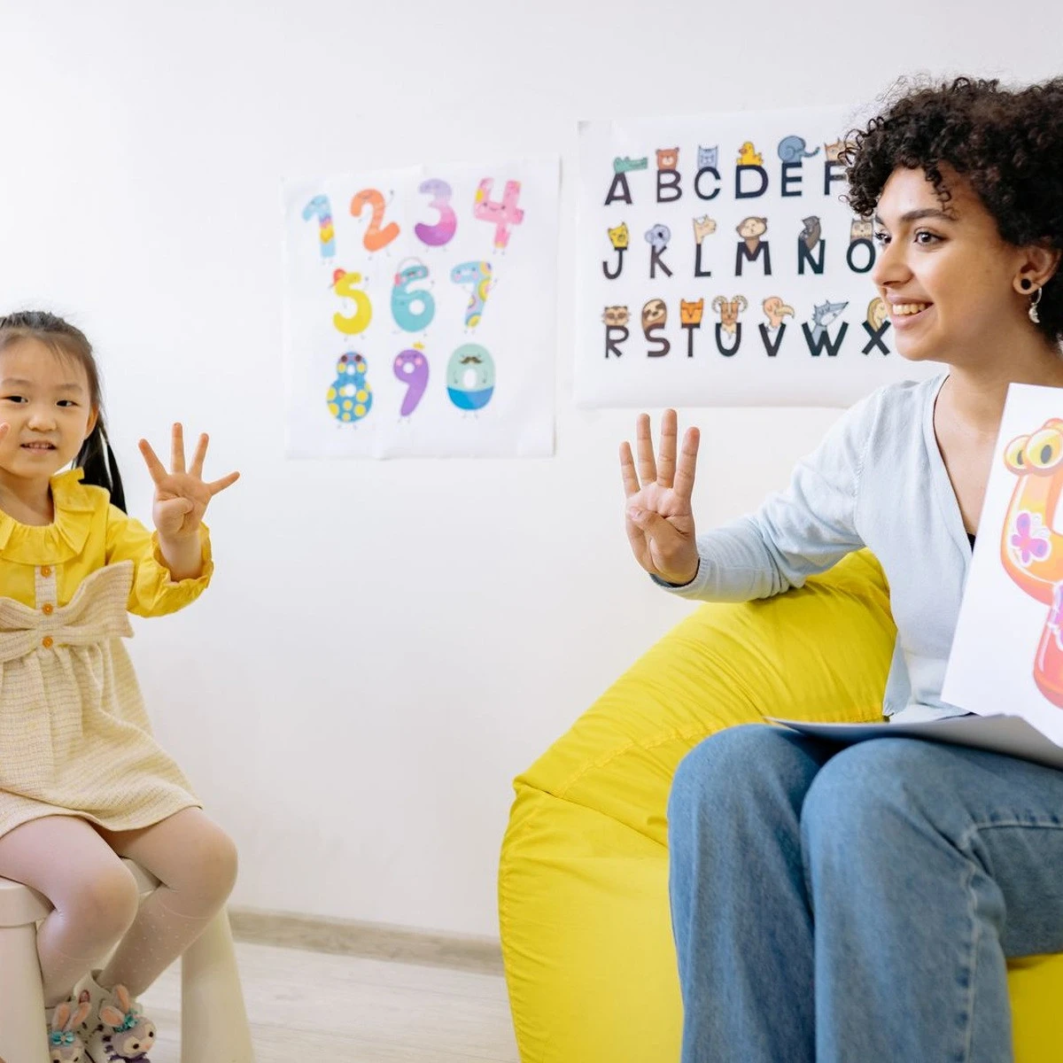 Child practicing a guided counting activity with a therapist for parent training for autism in Illinois